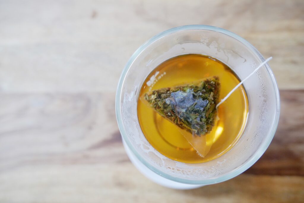 Cup of green tea with a tea bag