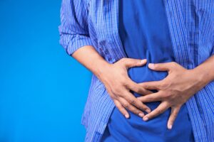 Can bad teeth cause stomach problems; man with stomach ache