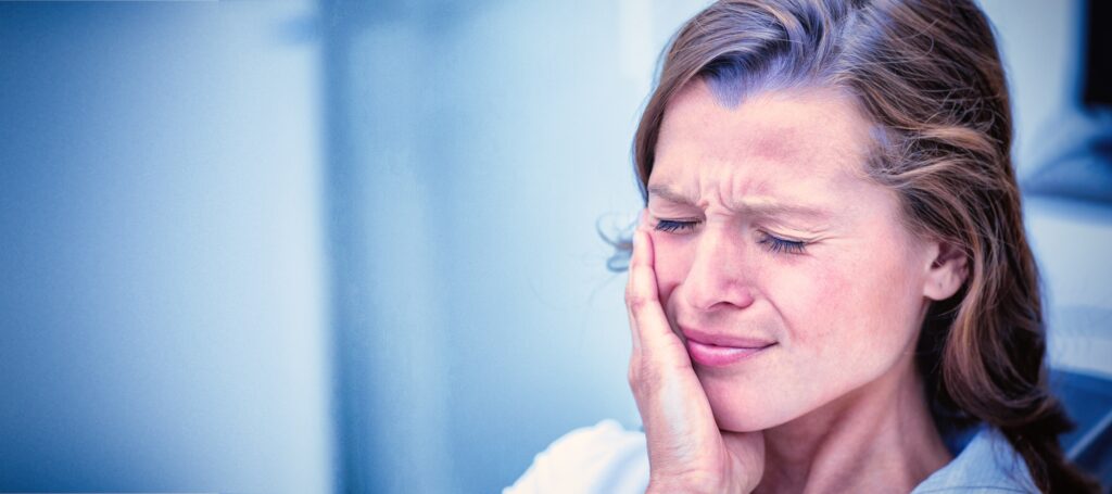 Emergency dental treatment in Turkey; woman with tooth pain