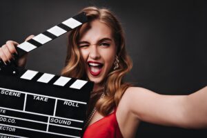 Hollywood Smile in Turkey; young lady holding clapperboard